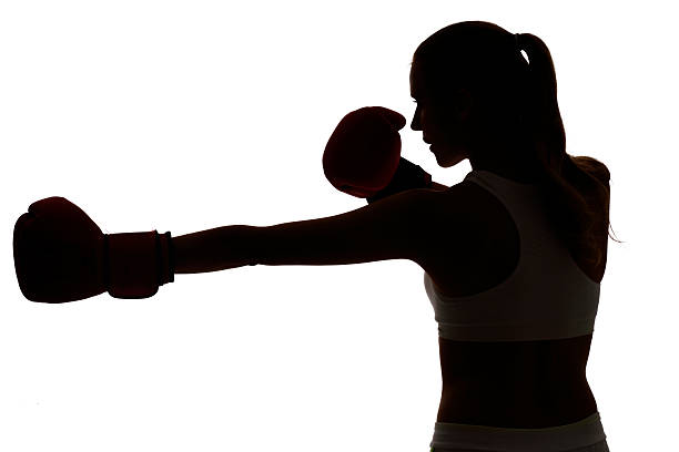 istock one caucasian woman boxing exercising in silhouette studio isola 489873372