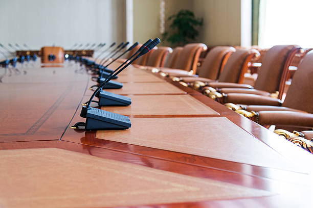 conference table conference table with group of microphones before conference. shareholders meeting stock pictures, royalty-free photos & images