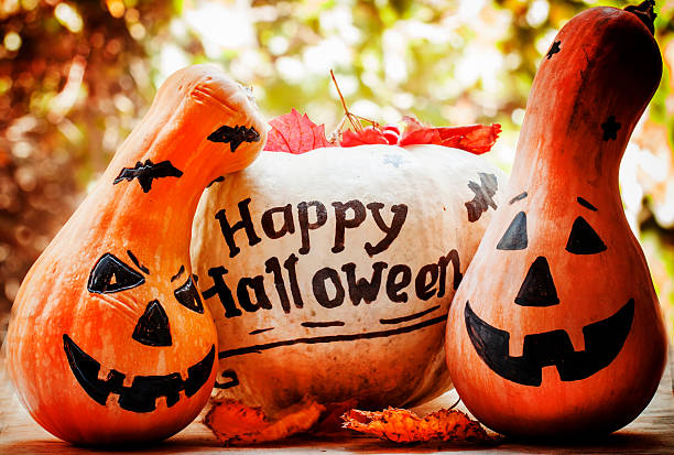 istock Halloween pumpkin on old wooden background, dark toned image 489875812