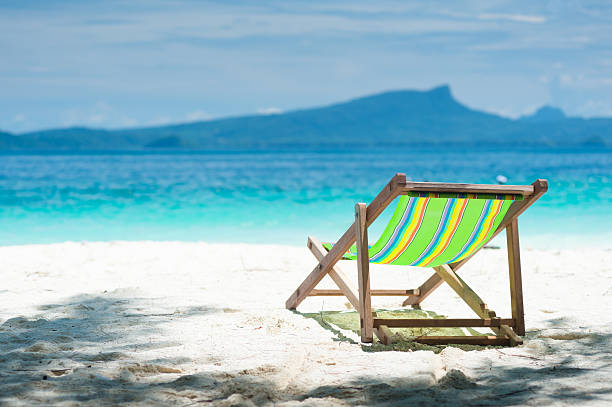 istock colorful beach chairs, clear, blue sky. 489898694