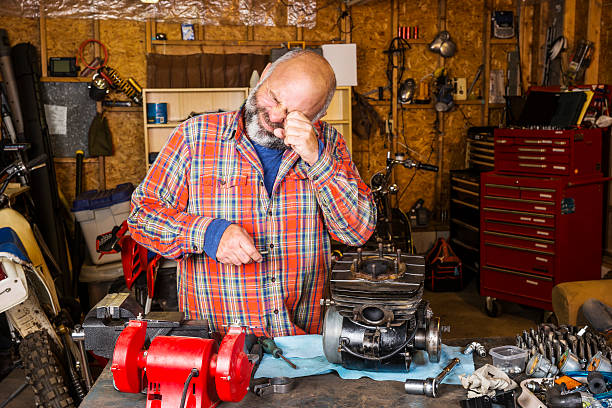 istock Man in a workshop with an eye injury 489899038
