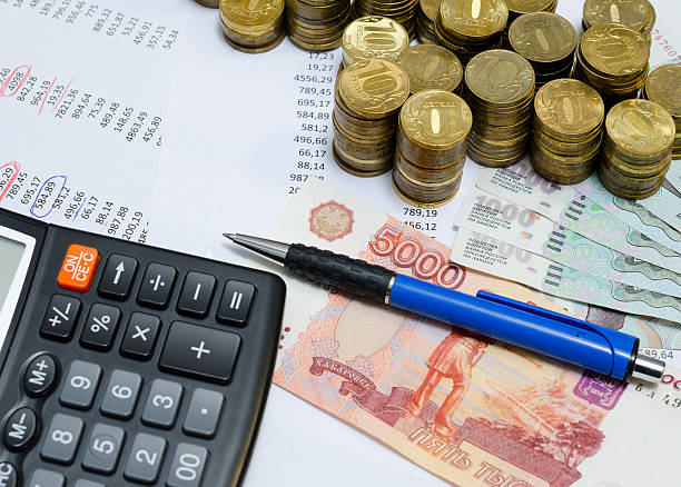 istock coins, ruble banknotes and calculator 489900226