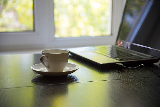 istock cup of coffee and laptop 489900268