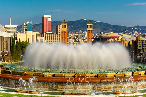 Magic Fountain of Montjuic at Placa Espanya in Barcelona at sunny summer day, Catalonia, Spain