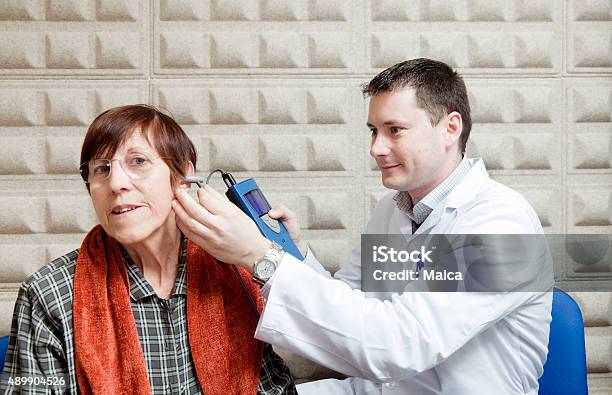 Ear Exam On An Old Lady Stock Photo - Download Image Now - Senior Adult, Listening, Hearing Test