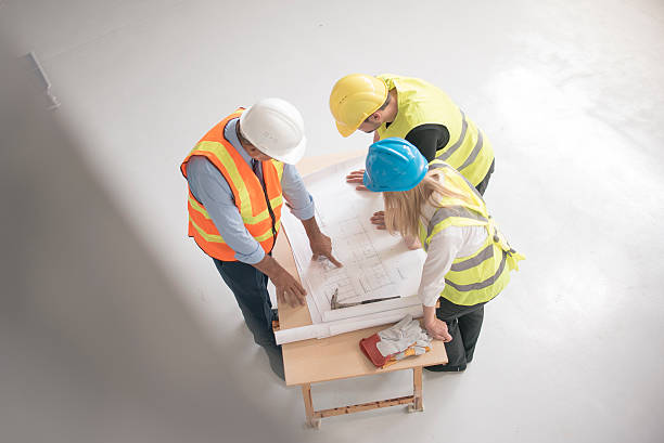 istock Group of engineers and architects supervising construction 489905368