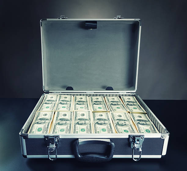 istock Case full of money on gray background 489905931