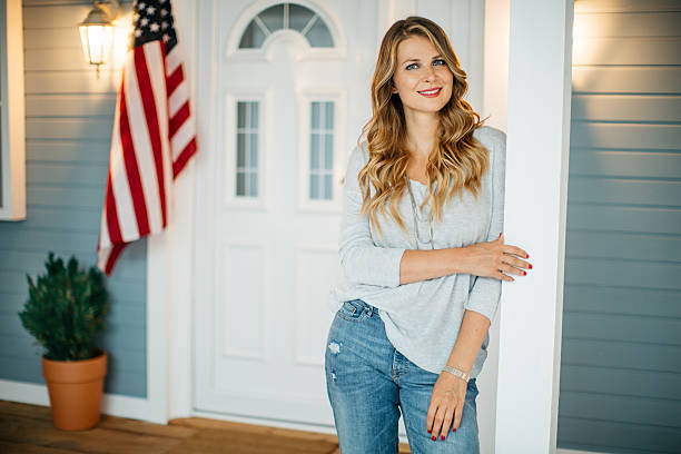 istock Woman in front of a house. 489906040