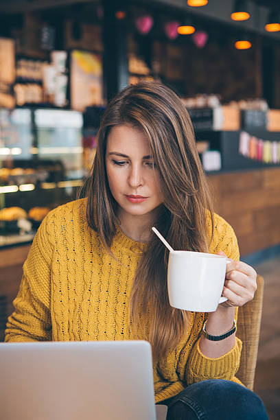 istock Woman with laptop at cafe. 489906106
