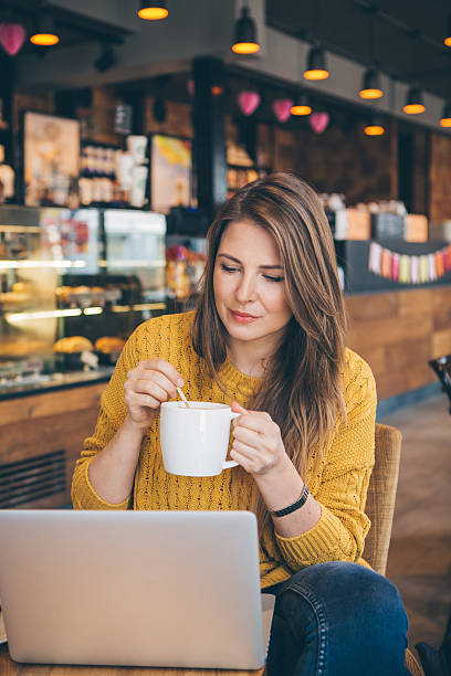 istock Woman with laptop at cafe. 489906118