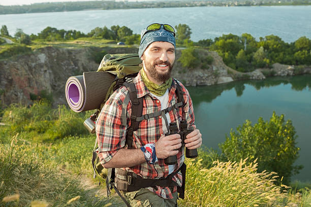 istock Young caucasian man with backpack walking on the top of 489906876