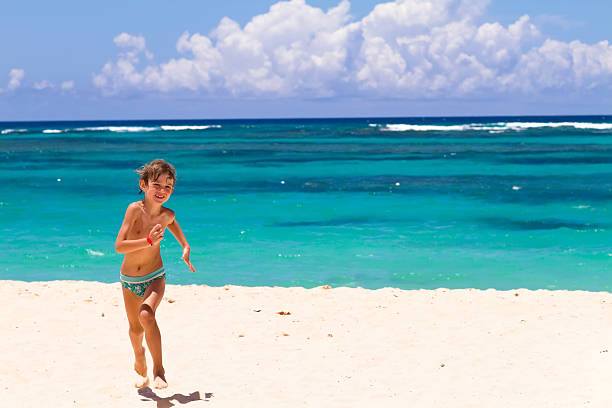 Young carefree woman relaxing in sea during her summer vacation. Copy space.