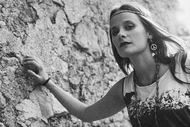 istock Girl with earring hippie peace symbol 489907564
