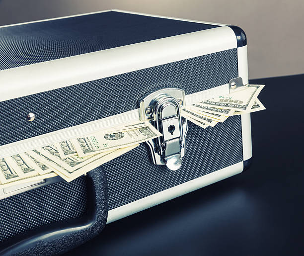 istock Case full of money on gray background 489907785