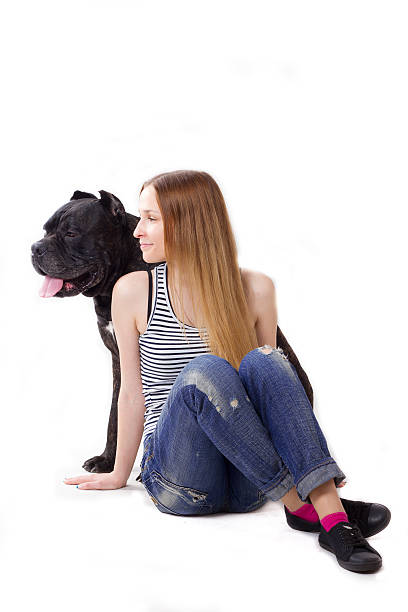 istock Girl with dog Cane Corso 489907842