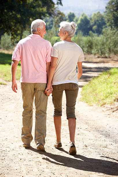 istock Senior couple on country walk 489908322