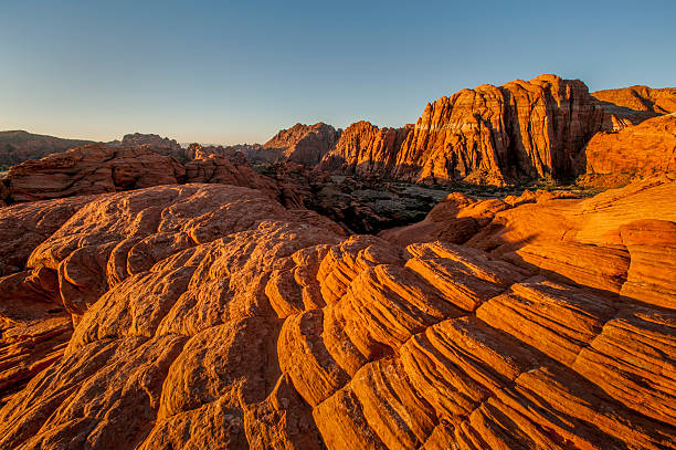 Petrified Mudflows, Snow Canyon State Park, Utah Sunrise over petrified mudflows and Navajo Sandstone, Snow Canyon, near St. George, Utah. snow canyon state park stock pictures, royalty-free photos & images