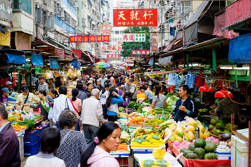 A busy street produce market in Hong Kong, China.