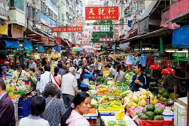 A busy street produce market in Hong Kong, China.
