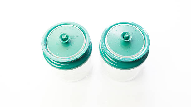 istock Empty transparent plastic food or spice container with green cap 489911448
