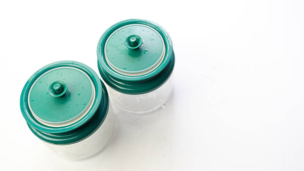 istock Empty transparent plastic food or spice container with green cap 489911508