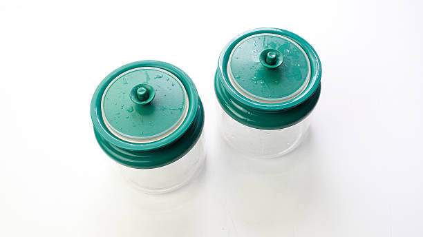 istock Empty transparent plastic food or spice container with green cap 489911578