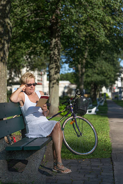 istock Woman relaxing in a park 489923906