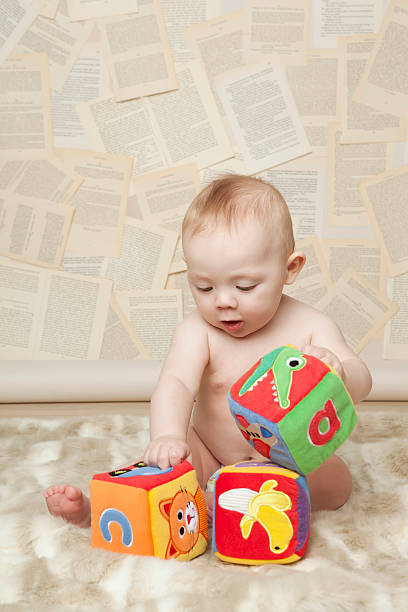 alphabet d'apprentissage pour bébés - dogeared photos et images de collection