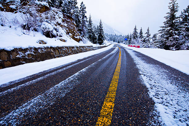 istock View of snow covered forest highway 489926778
