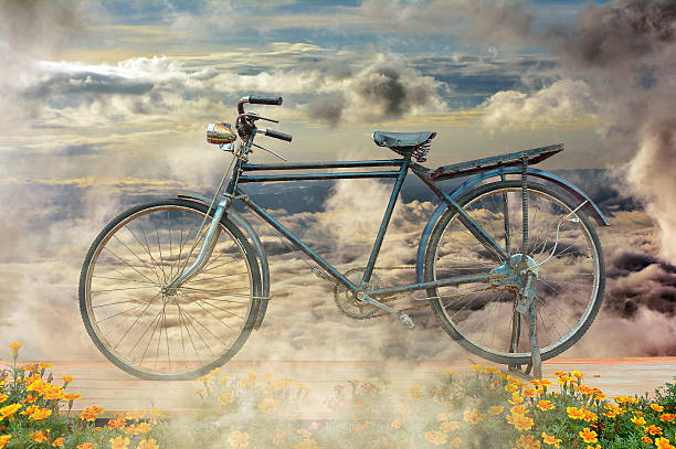 istock Antique Bicycle among clouds are flowing . 489928274