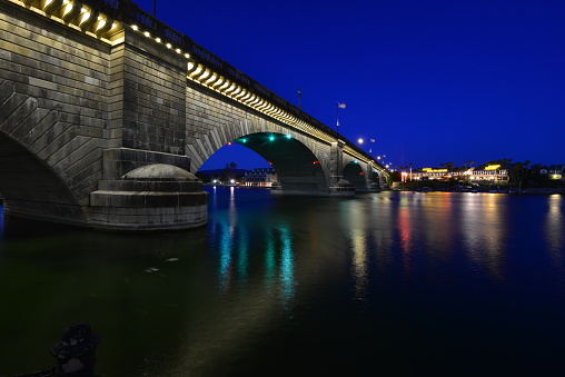London Bridge is a bridge in Lake Havasu City, Arizona, United States. It is a relocated 1831 bridge that formerly spanned the River Thames in London, England, until it was dismantled in 1967. The Arizona bridge is a reinforced concrete structure clad in the original masonry of the 1830s bridge, which was bought by Robert P. McCulloch from the City of London. McCulloch had exterior granite blocks from the original bridge numbered and transported to America to construct the present bridge in Lake Havasu City, a planned community he established in 1964 on the shore of Lake Havasu. The bridge was completed in 1971 (along with a canal), and links an island in the Colorado River with the main part of Lake Havasu City.