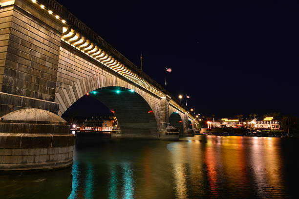 London Bridge is a bridge in Lake Havasu City, Arizona, United States. It is a relocated 1831 bridge that formerly spanned the River Thames in London, England, until it was dismantled in 1967. The Arizona bridge is a reinforced concrete structure clad in the original masonry of the 1830s bridge, which was bought by Robert P. McCulloch from the City of London. McCulloch had exterior granite blocks from the original bridge numbered and transported to America to construct the present bridge in Lake Havasu City, a planned community he established in 1964 on the shore of Lake Havasu. The bridge was completed in 1971 (along with a canal), and links an island in the Colorado River with the main part of Lake Havasu City.