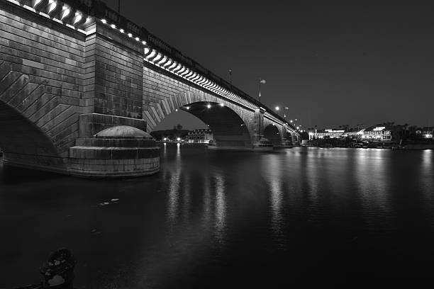 London Bridge is a bridge in Lake Havasu City, Arizona, United States. It is a relocated 1831 bridge that formerly spanned the River Thames in London, England, until it was dismantled in 1967. The Arizona bridge is a reinforced concrete structure clad in the original masonry of the 1830s bridge, which was bought by Robert P. McCulloch from the City of London. McCulloch had exterior granite blocks from the original bridge numbered and transported to America to construct the present bridge in Lake Havasu City, a planned community he established in 1964 on the shore of Lake Havasu. The bridge was completed in 1971 (along with a canal), and links an island in the Colorado River with the main part of Lake Havasu City.