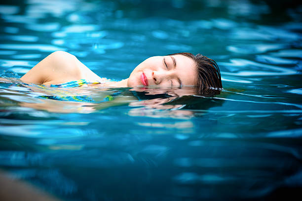 istock Young woman in the swimming pool 489929782