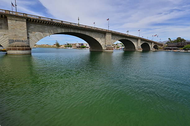 London Bridge is a bridge in Lake Havasu City, Arizona, United States. It is a relocated 1831 bridge that formerly spanned the River Thames in London, England, until it was dismantled in 1967. The Arizona bridge is a reinforced concrete structure clad in the original masonry of the 1830s bridge, which was bought by Robert P. McCulloch from the City of London. McCulloch had exterior granite blocks from the original bridge numbered and transported to America to construct the present bridge in Lake Havasu City, a planned community he established in 1964 on the shore of Lake Havasu. The bridge was completed in 1971 (along with a canal), and links an island in the Colorado River with the main part of Lake Havasu City.