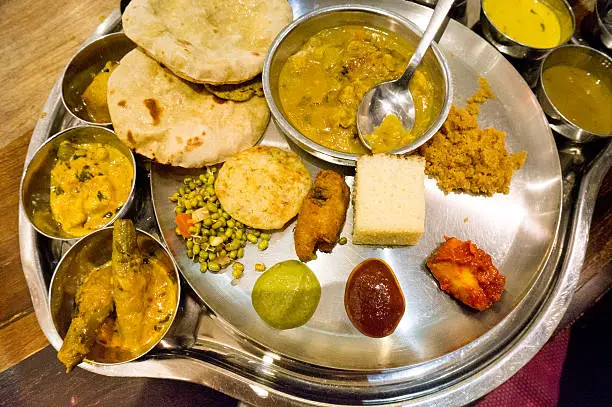 Set of north indian delicacies spread out for a celebration dinner.