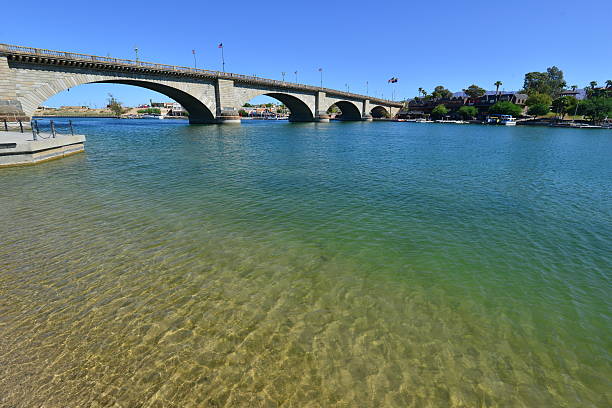 London Bridge is a bridge in Lake Havasu City, Arizona, United States. It is a relocated 1831 bridge that formerly spanned the River Thames in London, England, until it was dismantled in 1967. The Arizona bridge is a reinforced concrete structure clad in the original masonry of the 1830s bridge, which was bought by Robert P. McCulloch from the City of London. McCulloch had exterior granite blocks from the original bridge numbered and transported to America to construct the present bridge in Lake Havasu City, a planned community he established in 1964 on the shore of Lake Havasu. The bridge was completed in 1971 (along with a canal), and links an island in the Colorado River with the main part of Lake Havasu City.