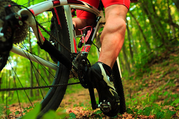 istock low angle view of cyclist riding mountain bike 489931294