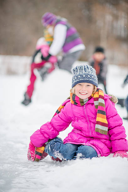istock Little Girl Sitting in the Snow 489932336