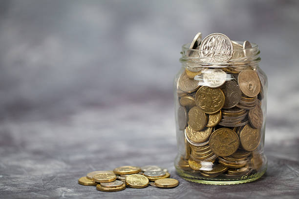 istock Jar Full of Coins 489933106