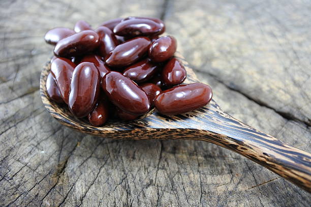 istock Red beans in a wooden spoon. 489934268
