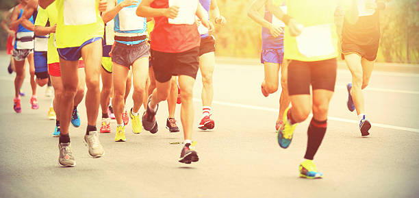 istock Marathon runner running on city road 489934474