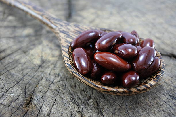 istock Red beans in a wooden spoon. 489934610