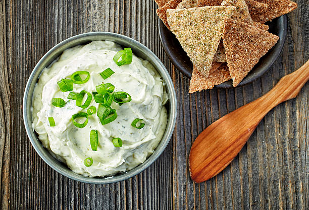 istock cream cheese with green onions and herbs 489935188