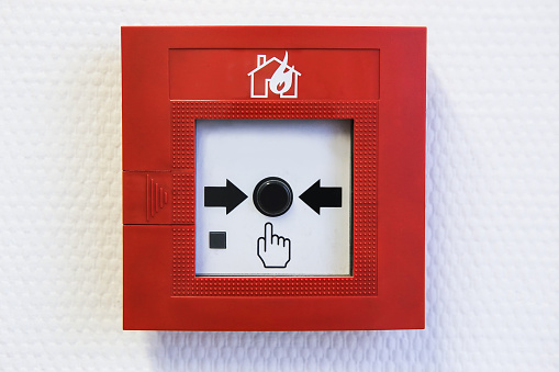 button of the fire alarm system on wall inside