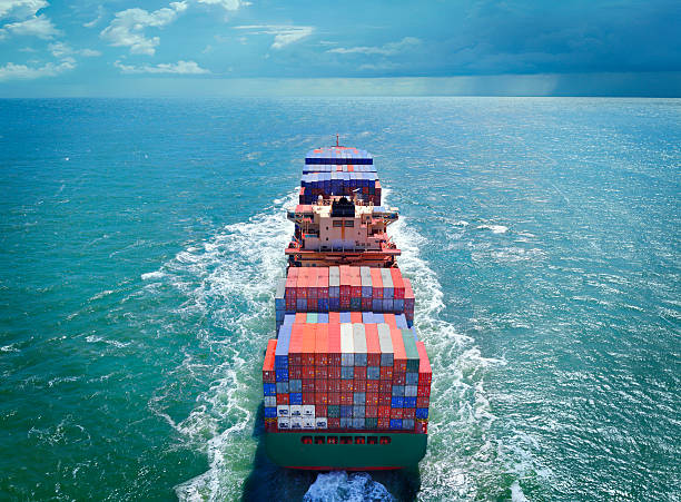 aerial view of freight ship with cargo containers - container ship stockfoto's en -beelden
