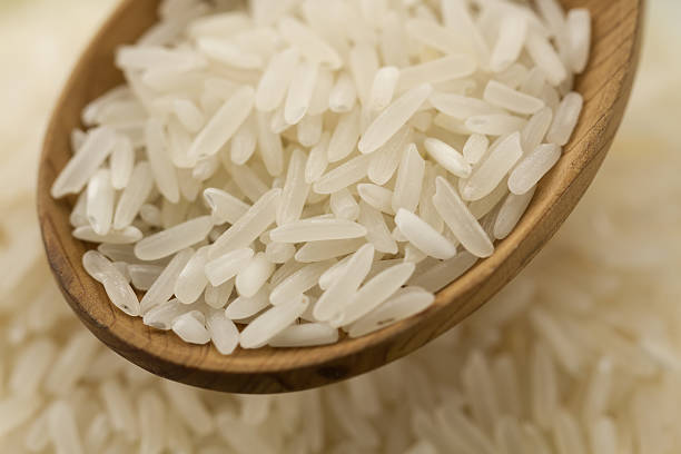 istock long grain rice in a wooden spoon 489948746