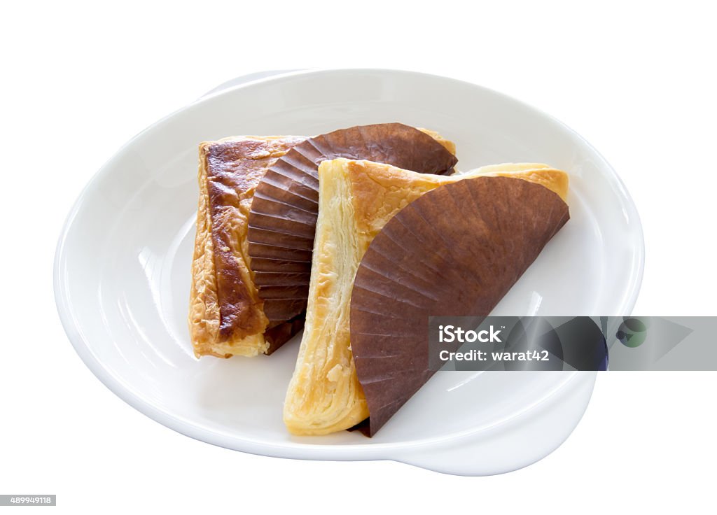 Pie triangular shape on white dish, isolated on white background Pie triangular shape on white dish, isolated on white background. 2015 Stock Photo