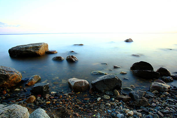 istock beach stone coast water frozen landscape 489952352