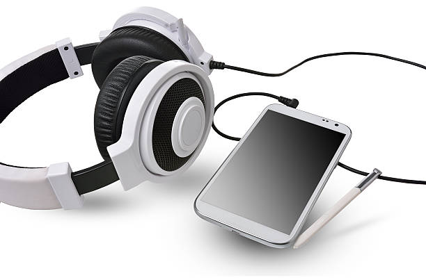 istock White headphones and smart phone on white background. 489952696